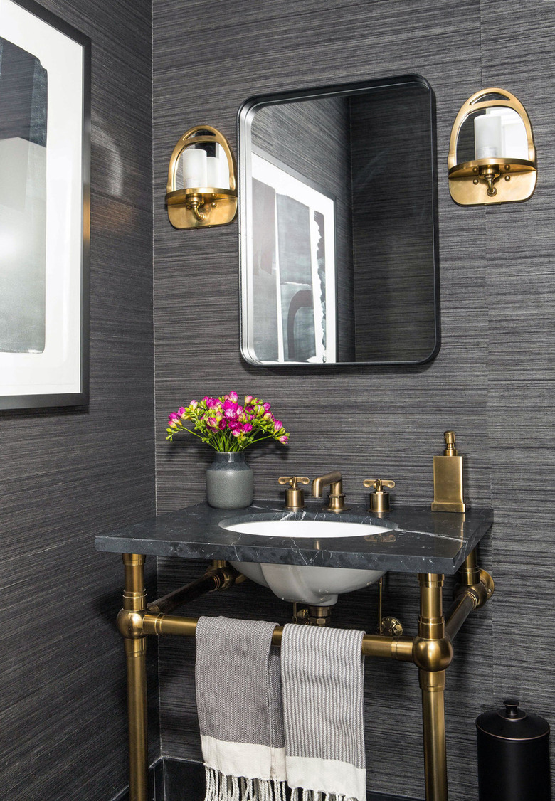 dark gray industrial wallpaper in a powder room