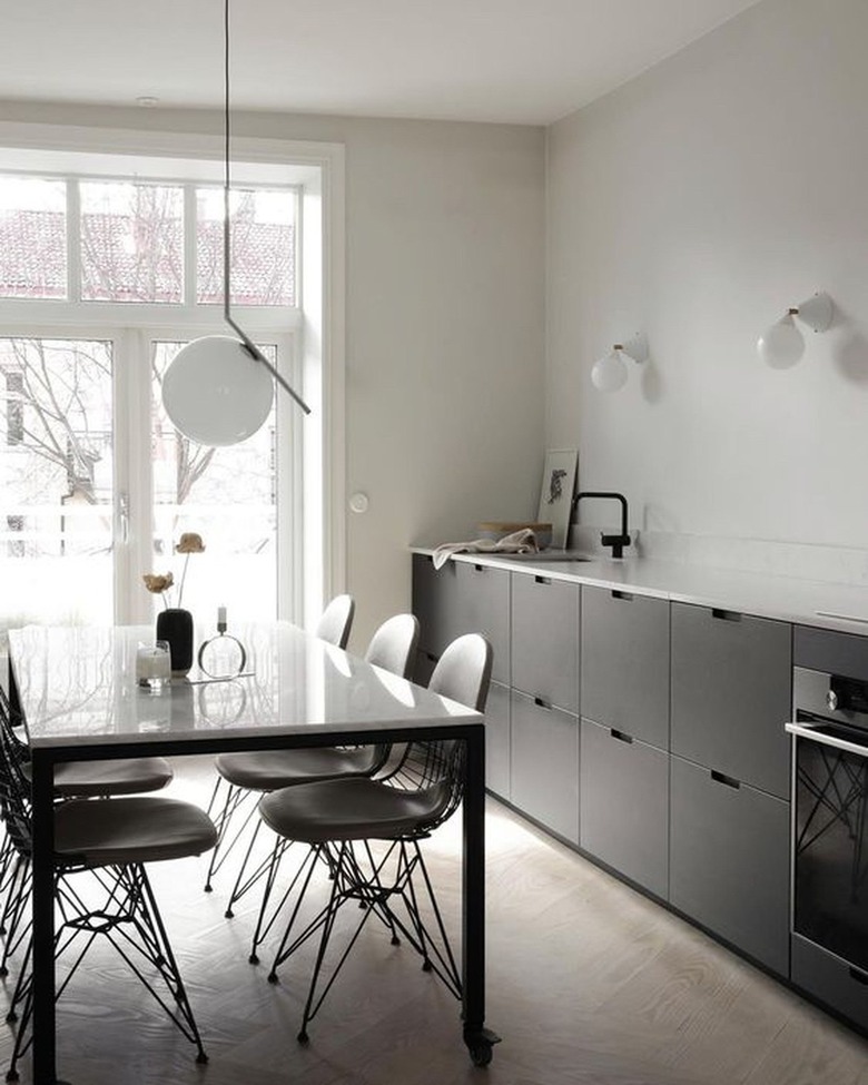 contemporary kitchen with black cabinets and no hardware