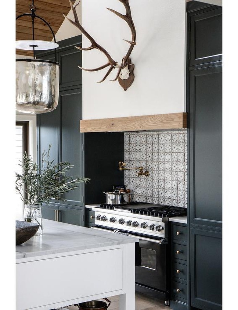 Spanish style kitchen with black cabinets