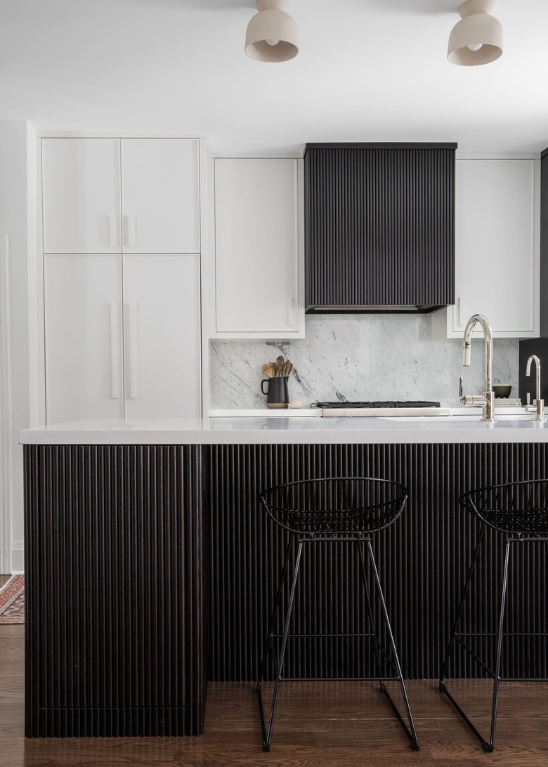 black ad white kitchen with reed cabinetry