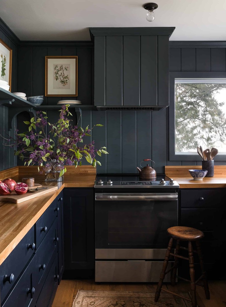 black kitchen with shiplap backsplash