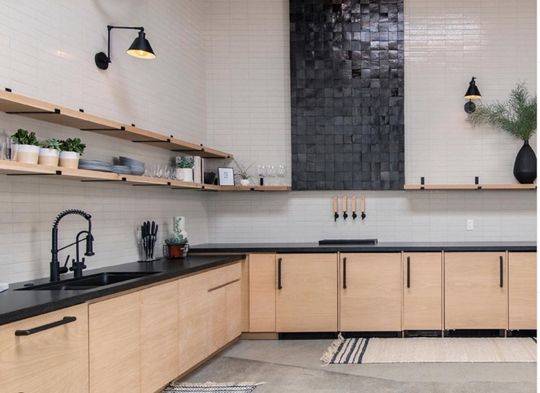 white tile backsplash with black vertical tiled component