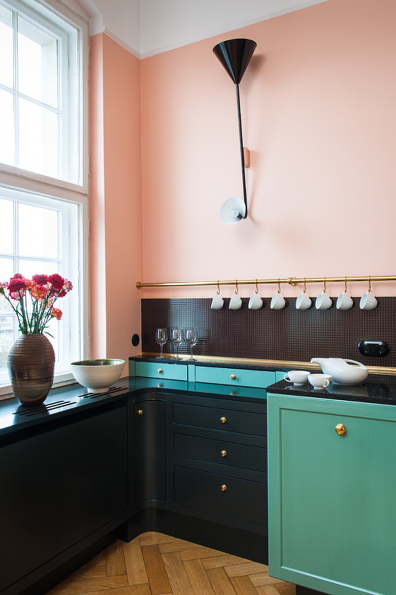 black kitchen backsplash in pink and green kitchen