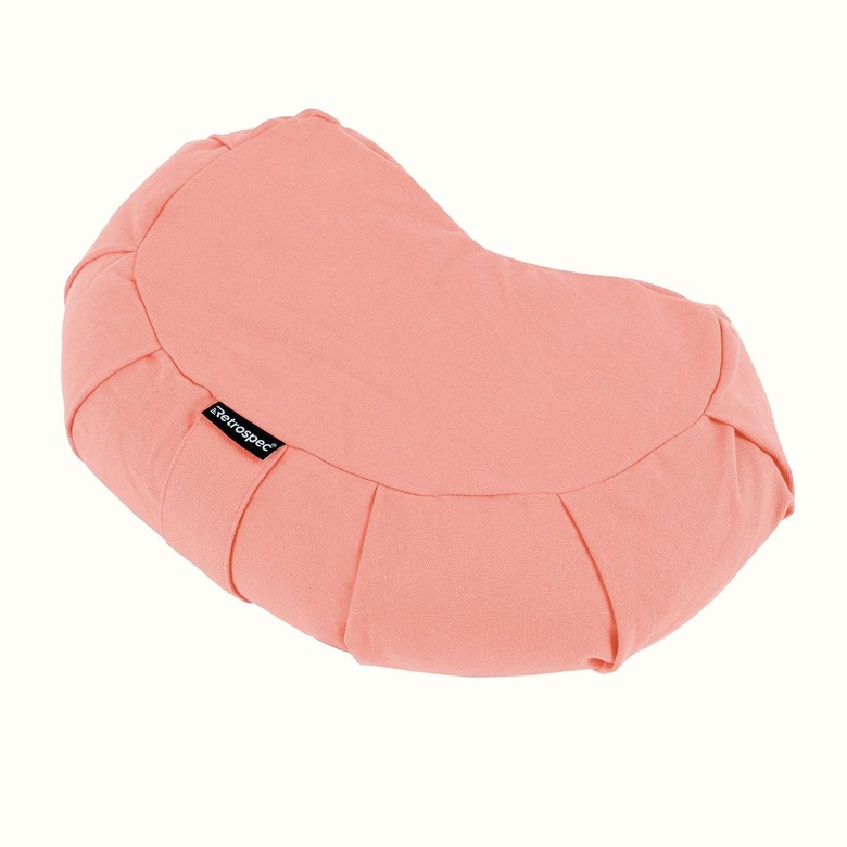 pink crescent-shaped floor pillow