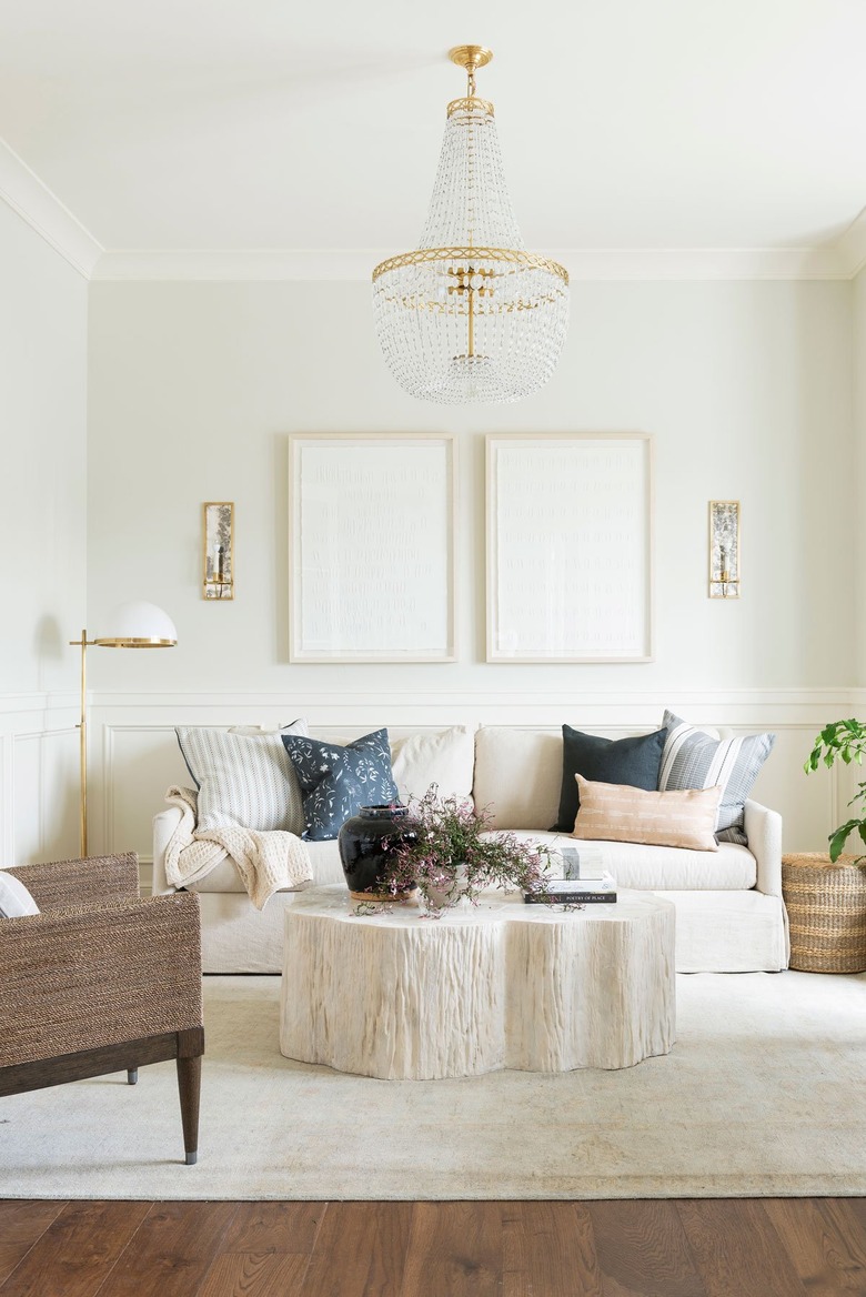 ivory color idea in sitting room with crystal chandelier and ivory furniture