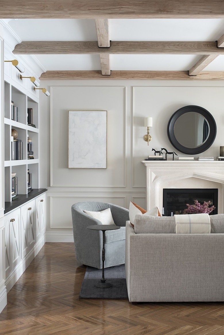 ivory color idea in formal living room with ivory walls and sunwashed wood beams