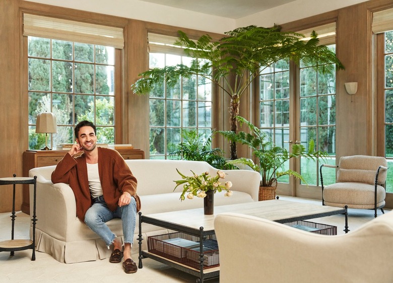 Jake Arnold in a beige living room.