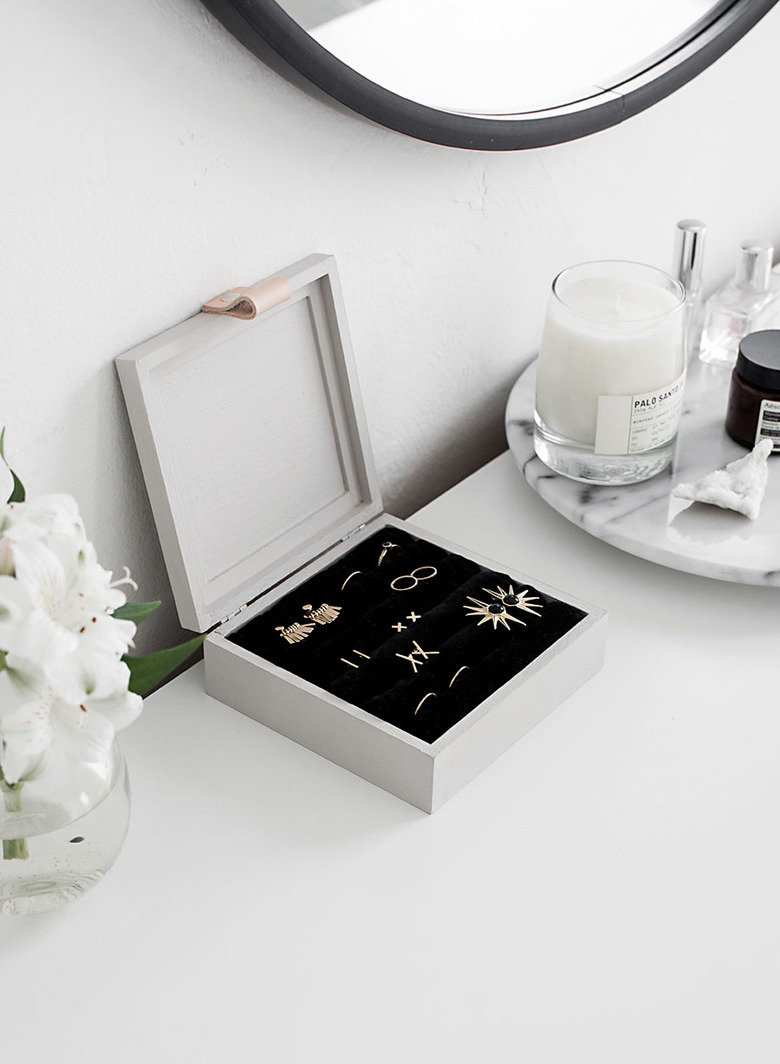 white jewelry organizer idea with black velvet interior