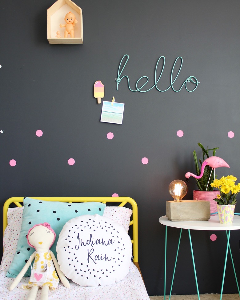 kids bedroom idea with black walls and pops of neon color