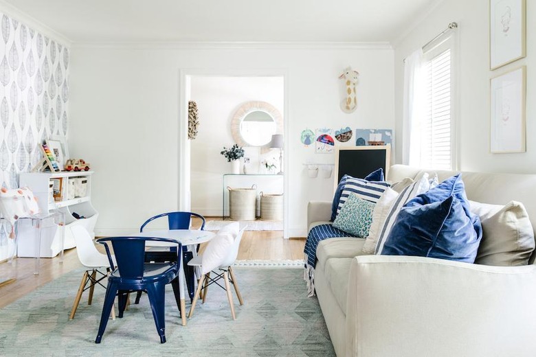 traditional kids playroom idea with large sofa and small table and chairs