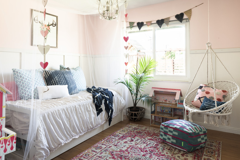 Pink kids' bedroom idea with daybed and feminine touches