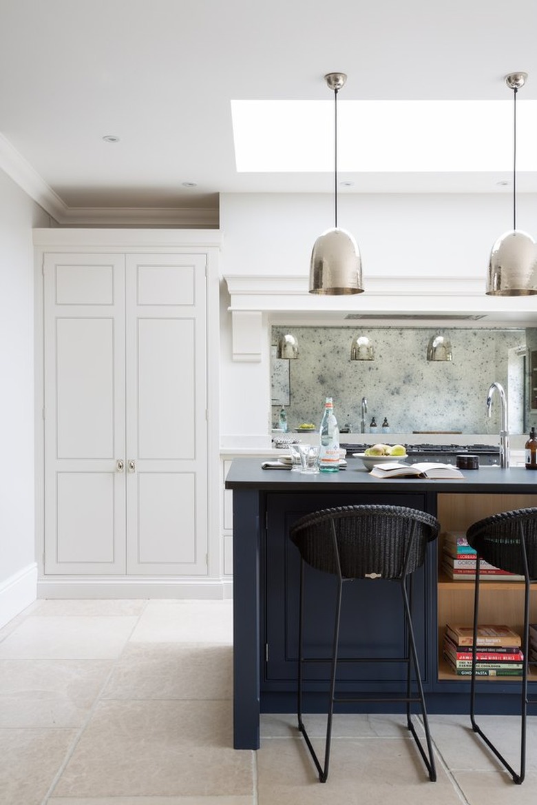 mirror kitchen backsplash idea with white cabinets and blue island