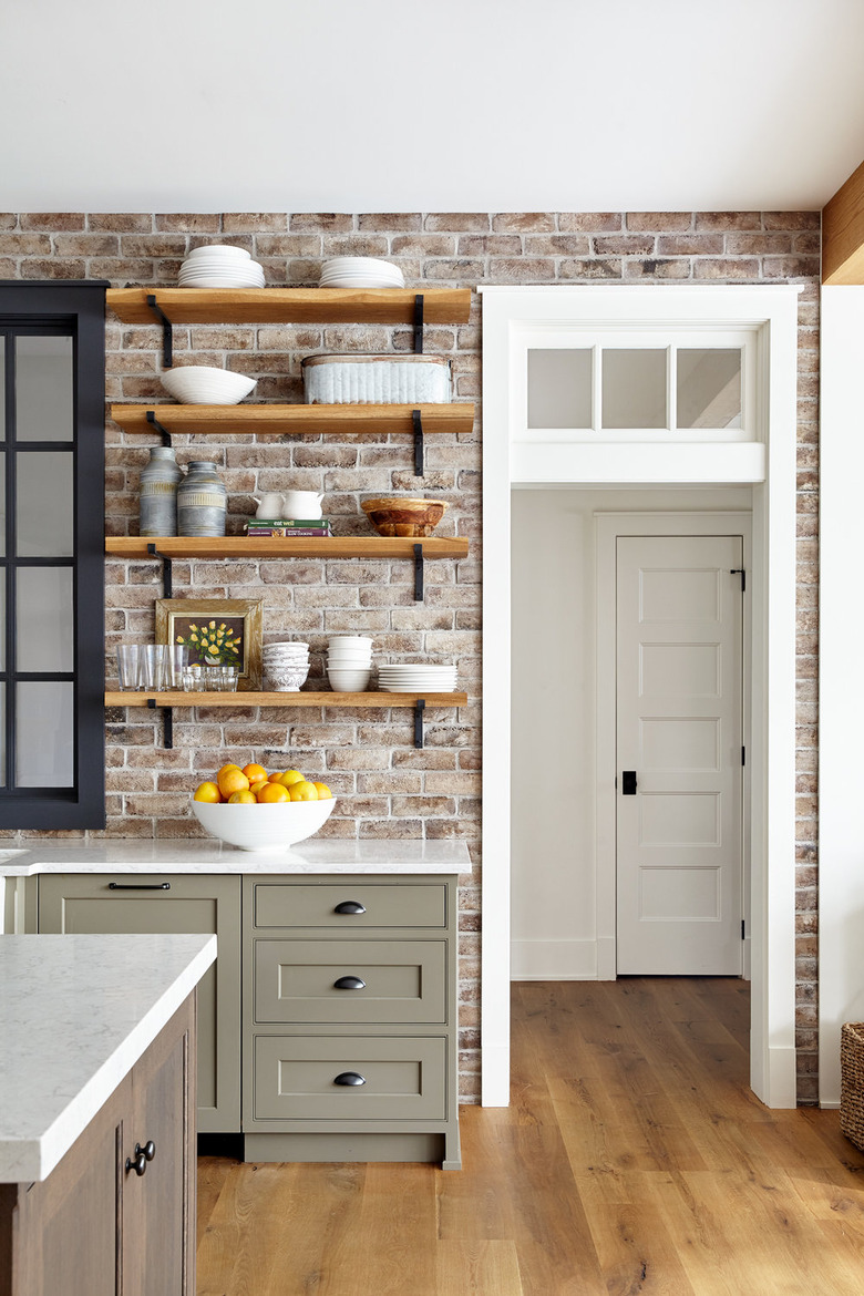 exposed brick kitchen backsplash idea in country kitchen