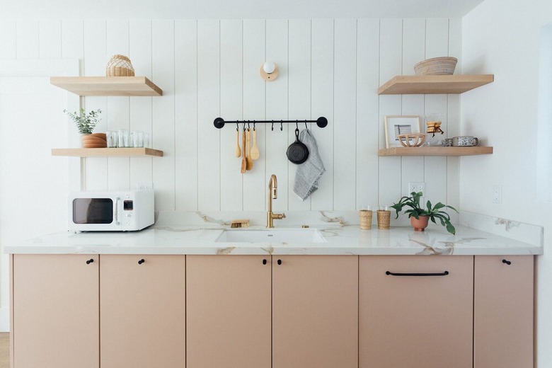 pink kitchen cabinet color with marble countertop