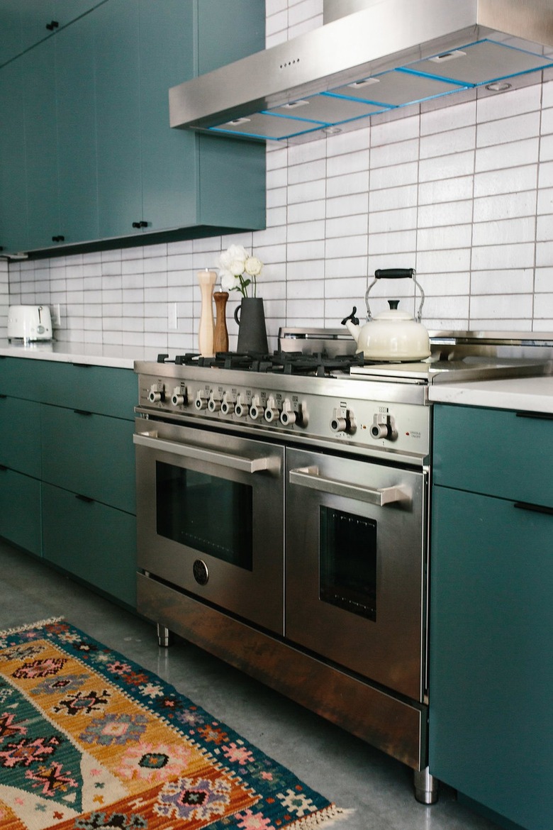 teal cabinets in modern kitchen