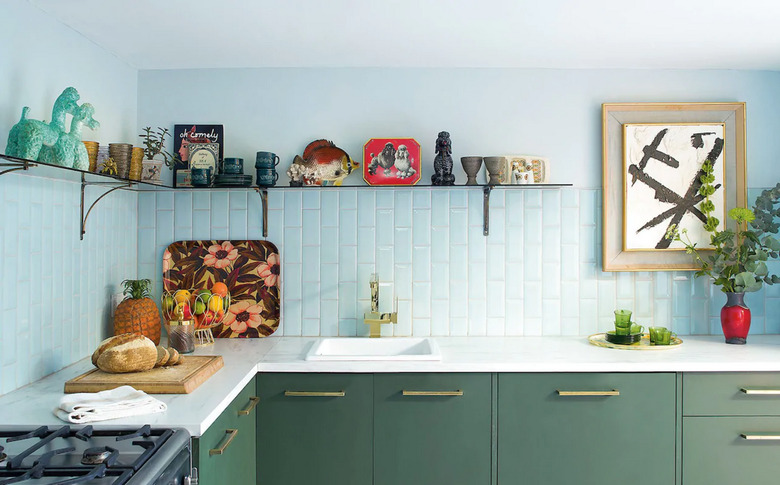 purish blue kitchen with blue tiles and green cabinetry