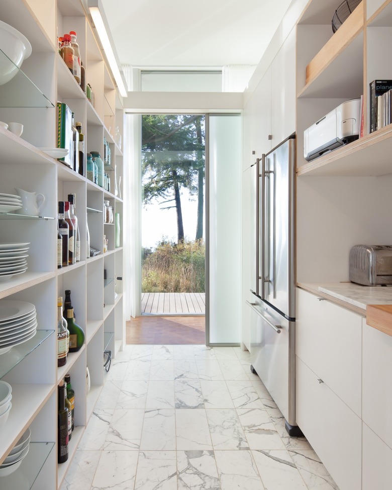 Galley kitchen flooring idea with marble tile