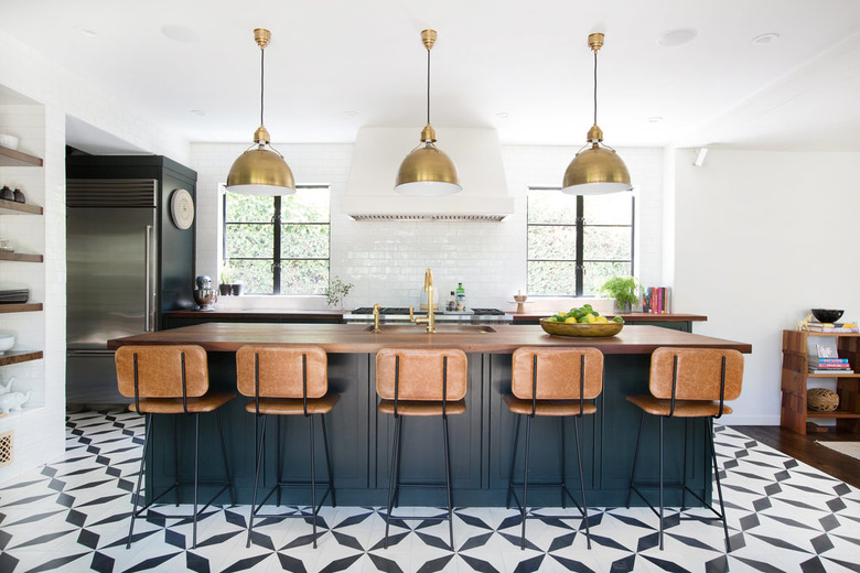 ceramic tile kitchen flooring with blue island and wood countertop