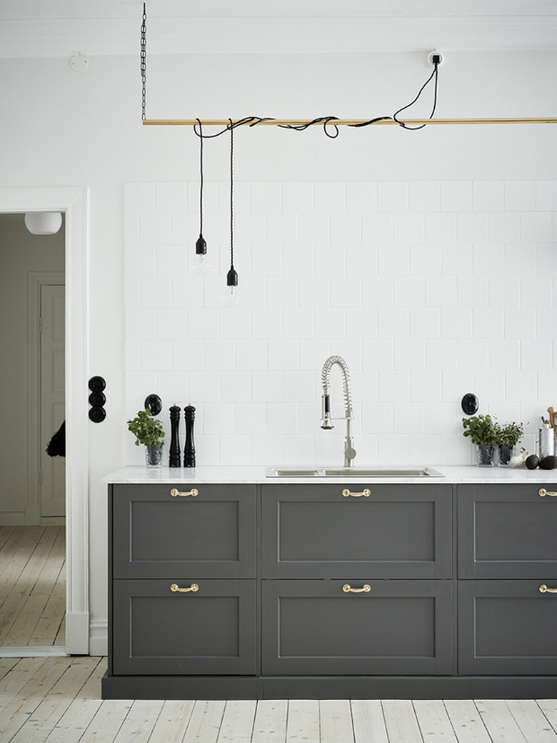 kitchen with gray cabinets and light wood floors