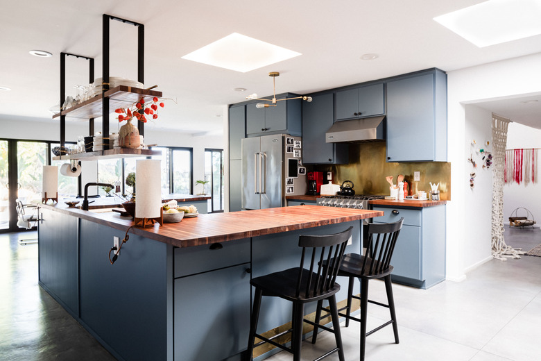 kitchen with gray cabinets and concrete floors