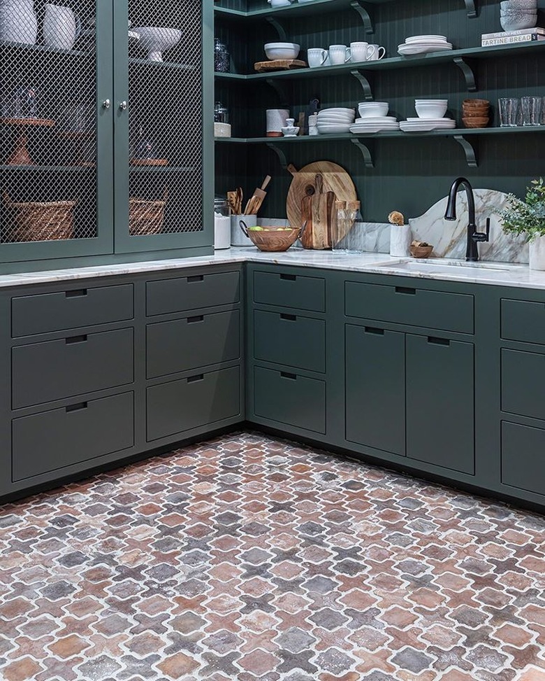 kitchen with tile floor and dark cabinets