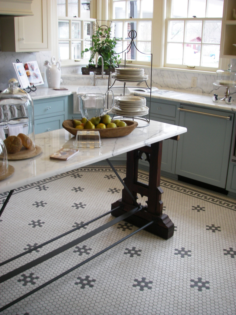 kitchen with island and cafe mosaic style flooring