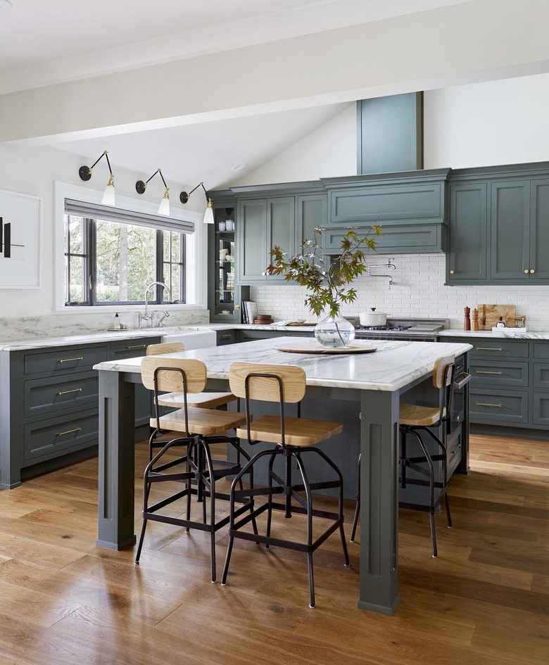 simple kitchen island decor with foliage clipping in kitchen with green cabinets