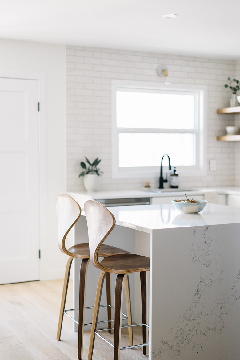 marble kitchen island ideas with seating and curved wooden chairs