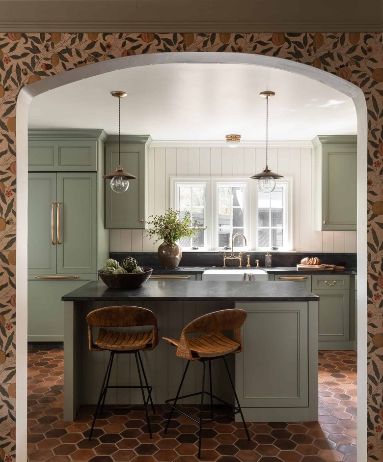 eclectic kitchen island ideas with seating, wallpaper, and brick hex floor