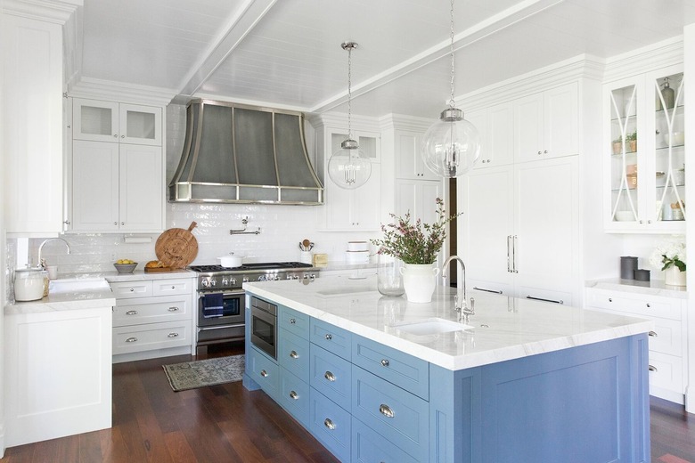 Blue cabinetry with kitchen island sink