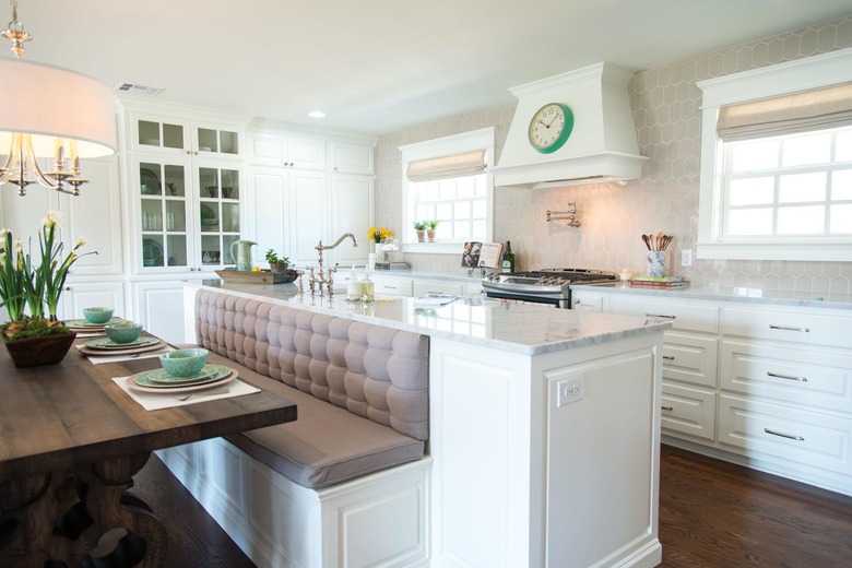 kitchen island with bench seating in traditional white kitchen