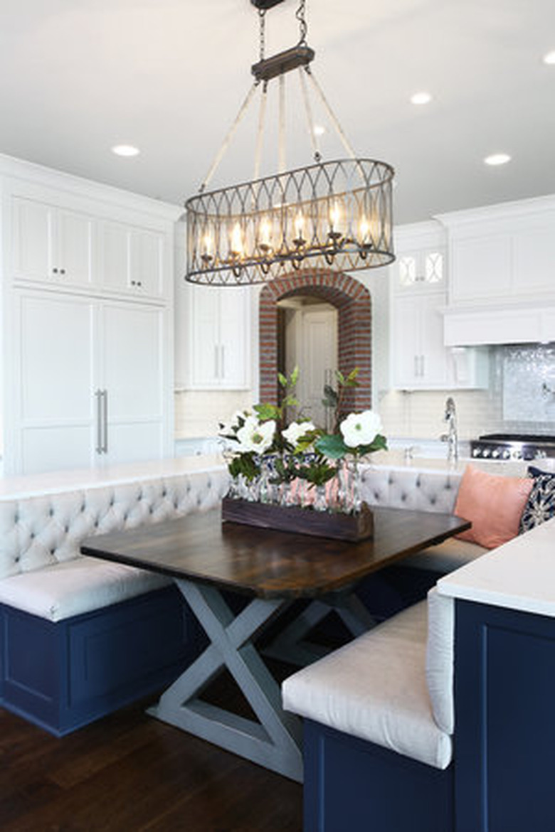 U-shaped kitchen island with bench seating in traditional kitchen