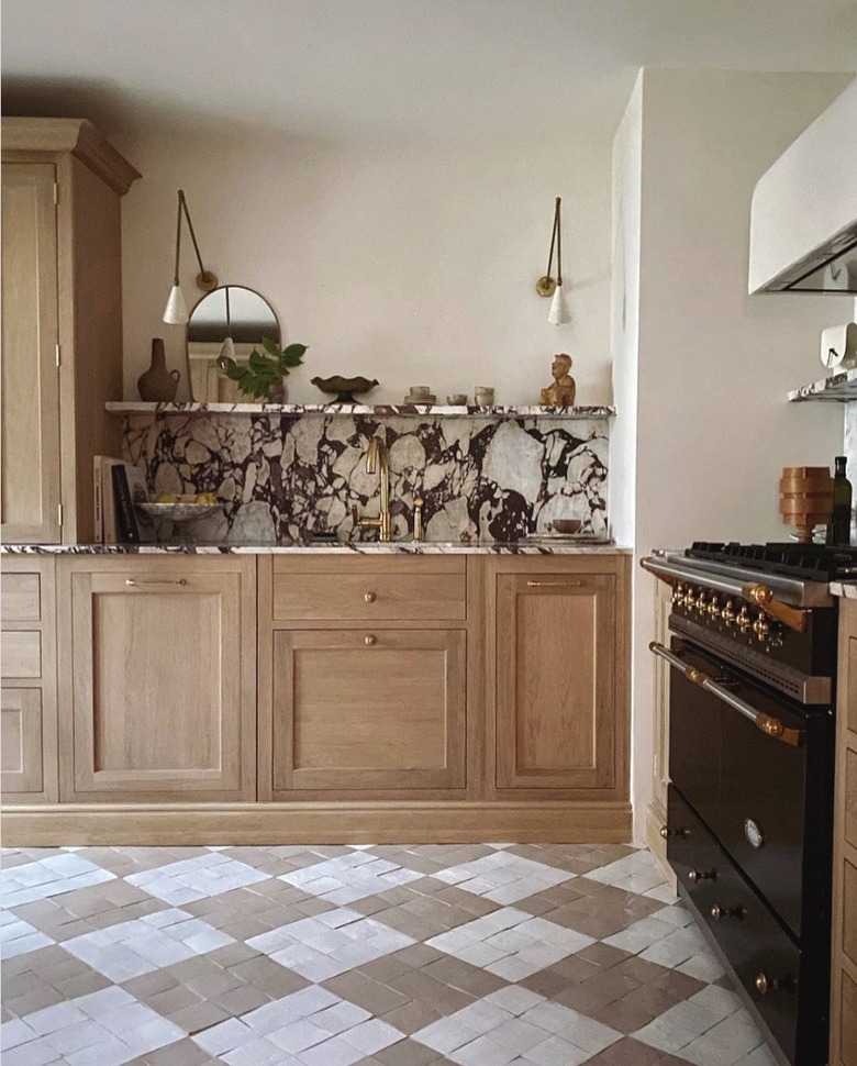 bold marble backsplash in wood and white kitchen