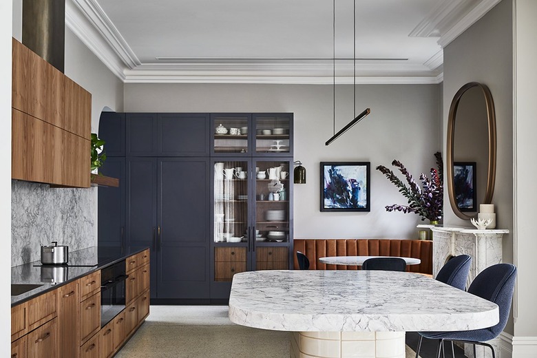 modern kitchen with wood cabinets and marble backsplash