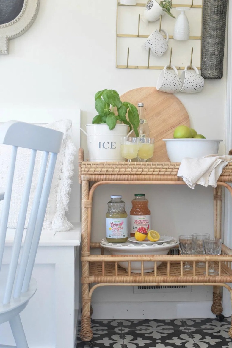 rattan kitchen cart next to kitchen banquette