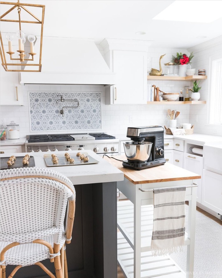 wood and white kitchen cart next to white kitchen island