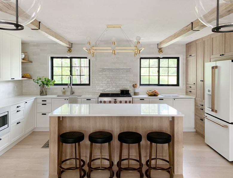 IKEA kitchen with wood and white cabinetry and white countertops