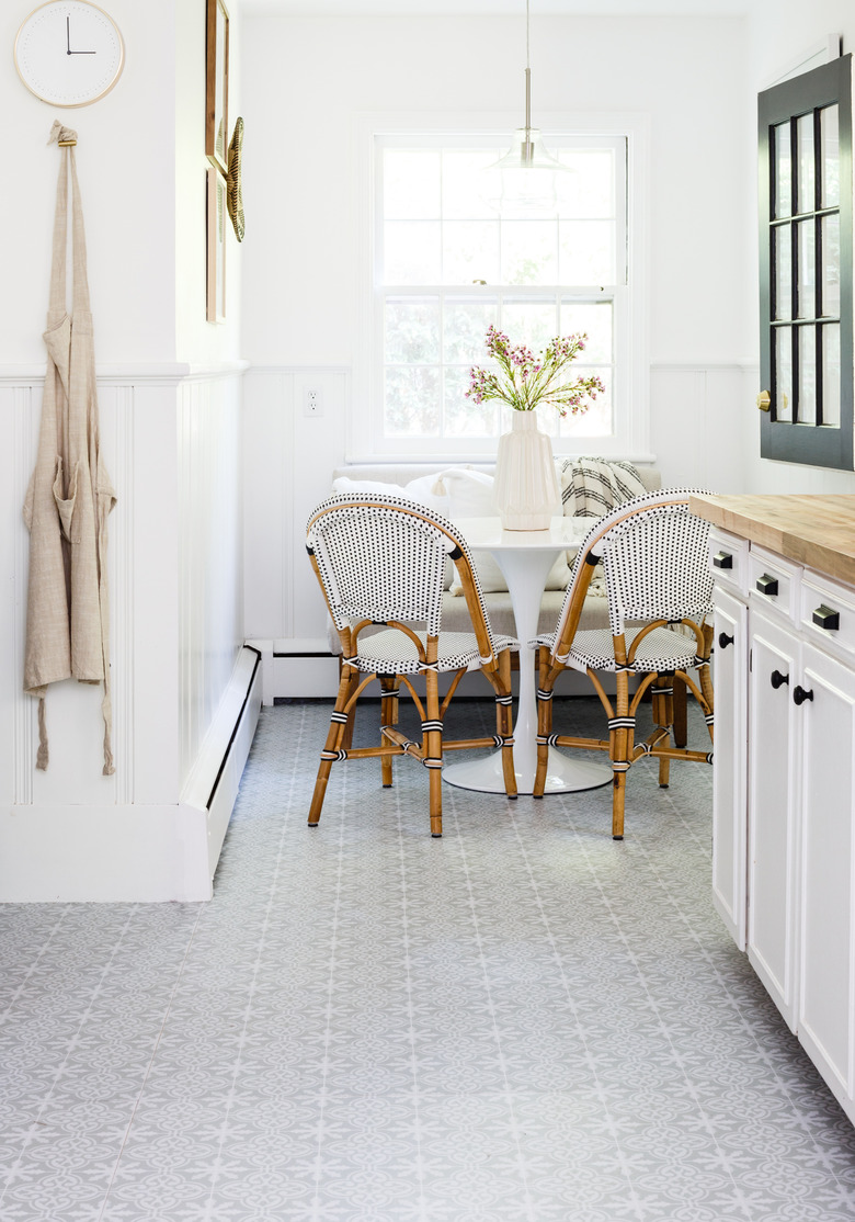 peel and stick kitchen vinyl flooring with white cabinets and wood countertop