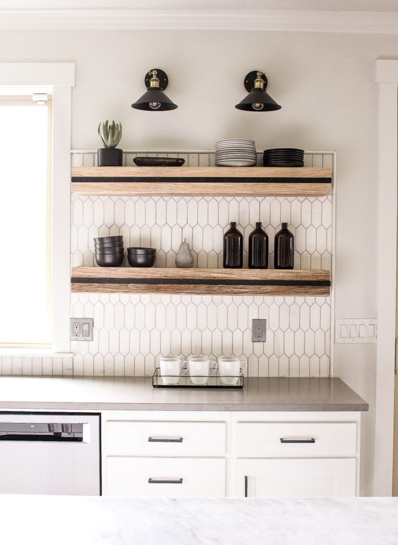 black barn light wall sconces over black and wood open shelves