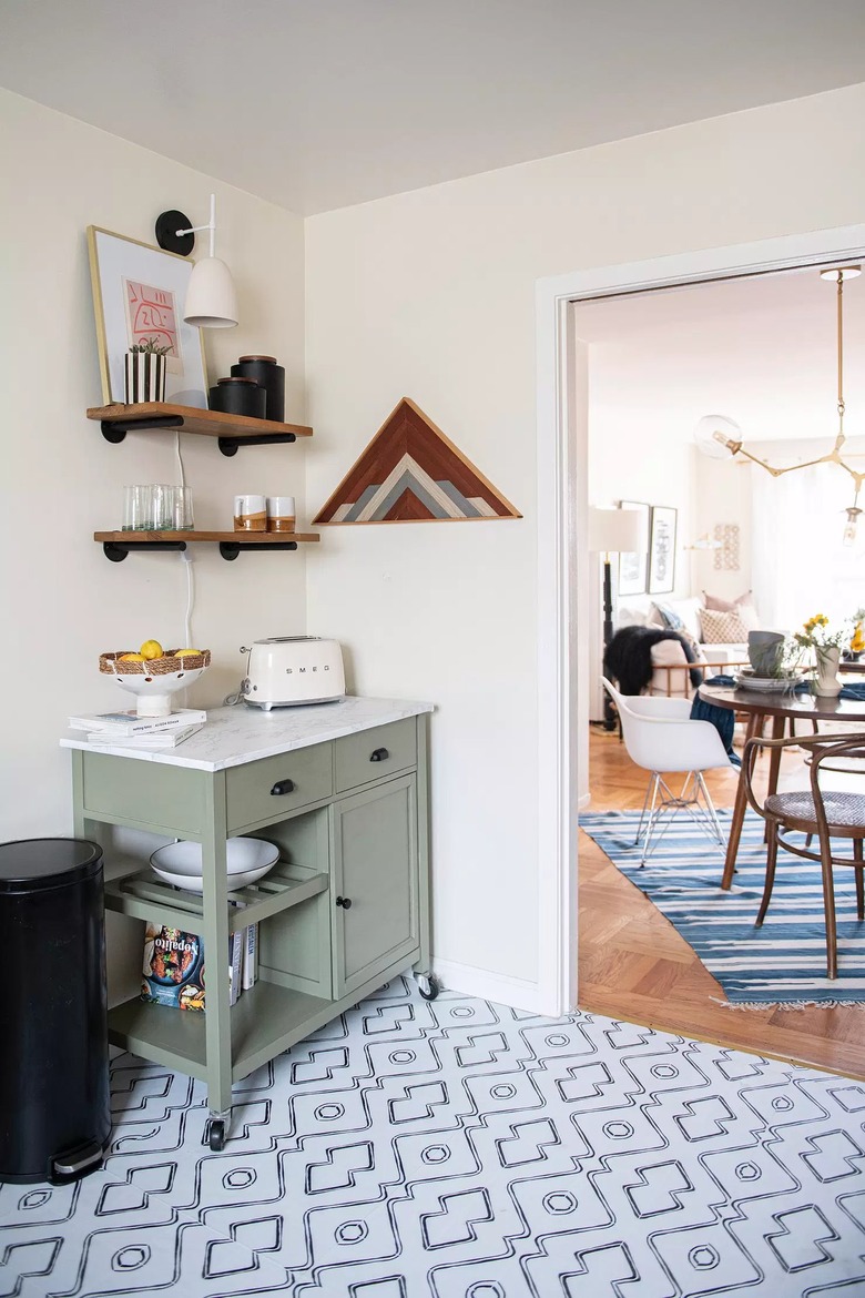 modern black and white wall sconce in corner with kitchen cart