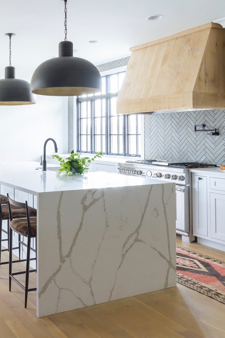 Kitchen with matte finish stone tile backsplash