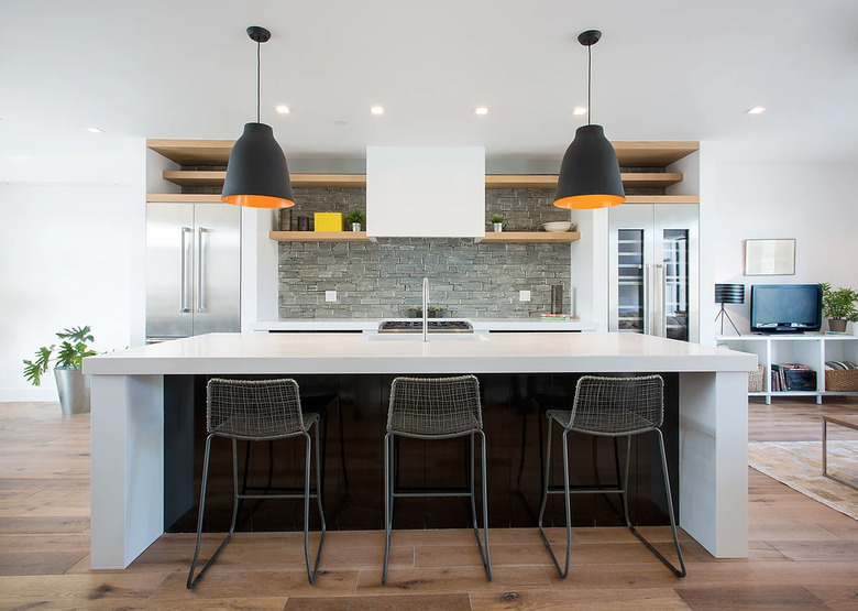 Kitchen with stone tile backsplash