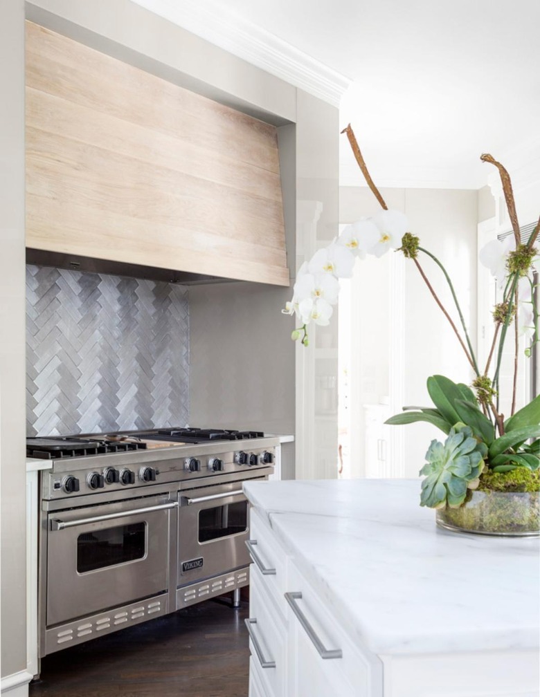 modern kitchen with herringbone pattern metal tile backspalsh