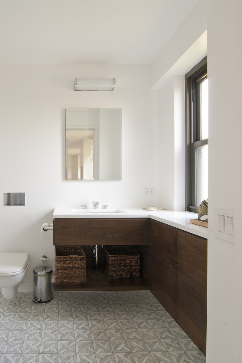 New York City apartment bathroom with L-shaped vanity