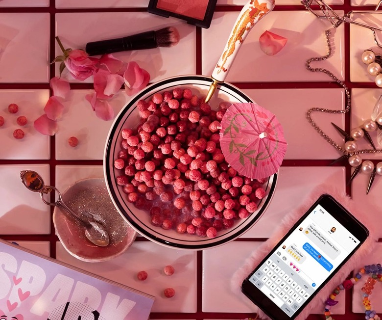 pink cereal with phone next to bowl