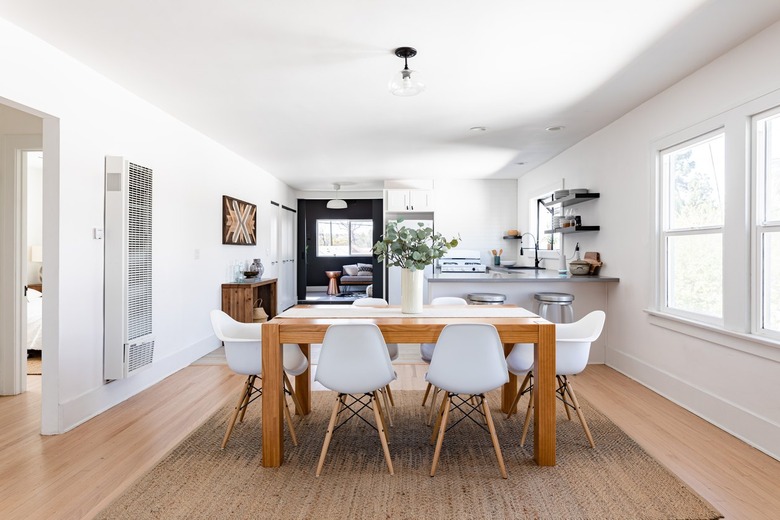 dining room with wood table and white chairs