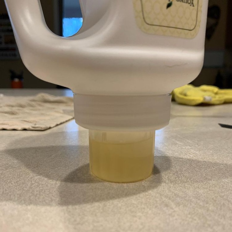 detergent collecting in cap of upside-down detergent bottle