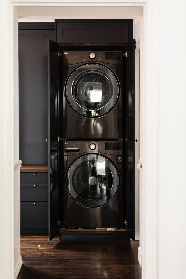 black washer and dryer stacked