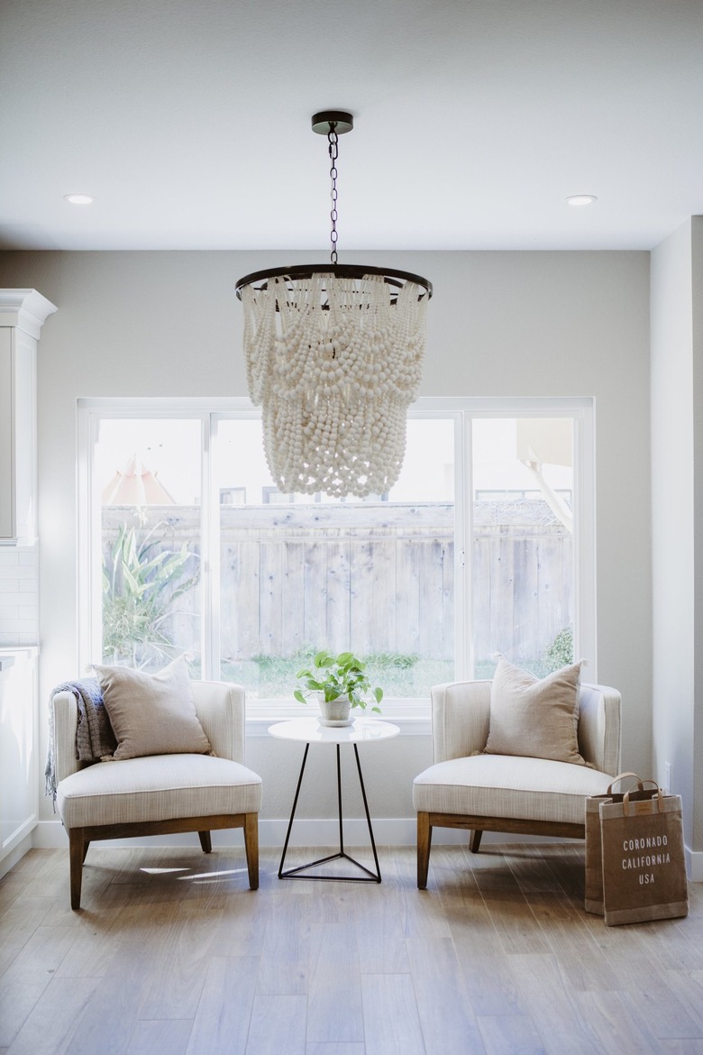 sitting area with wood beaded chandelier