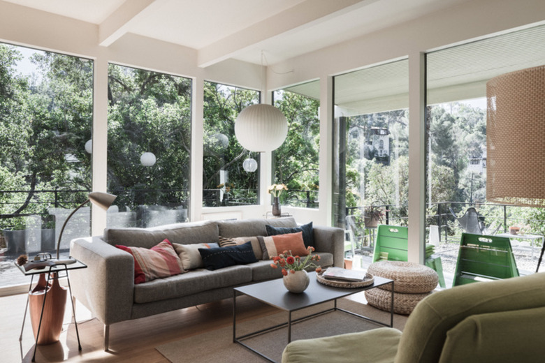 A ball pendant by Herman Miller compliments this mid-century living room.